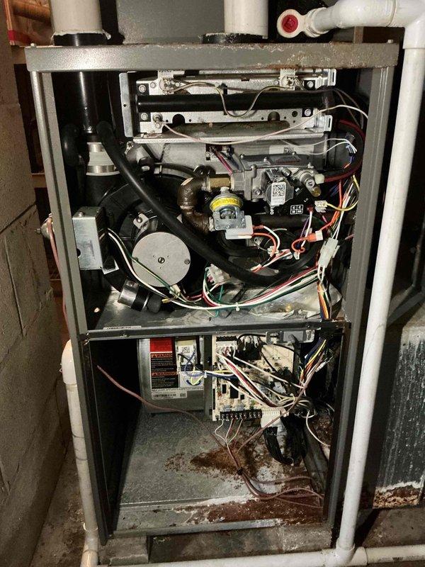 Performed comprehensive furnace maintenance including inspection of internal components, electrical connections, and gas control valve assembly. Removed accumulated dust and addressed minor corrosion. Conducted flue gas analysis using Testo 310 analyzer, which confirmed proper system operation with excellent efficiency (95.7%), appropriate oxygen levels (7.0%), and safe CO readings (7 ppm), indicating the system is operating within manufacturer specifications.