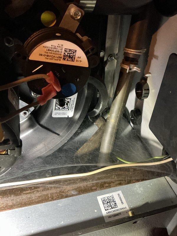 Performed comprehensive MVP tune-up on the heating system, which included inspection and testing of the pressure switch and associated components. Examined the ventilation piping and valve connections, documenting their condition with photographs, and verified all connections were secure and functioning properly.