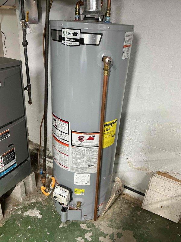 Performed comprehensive furnace maintenance service on residential HVAC system adjacent to A.O. Smith ProLine water heater. Inspected all furnace components, cleaned critical elements, and verified proper operation of heating system for optimal efficiency and safety.