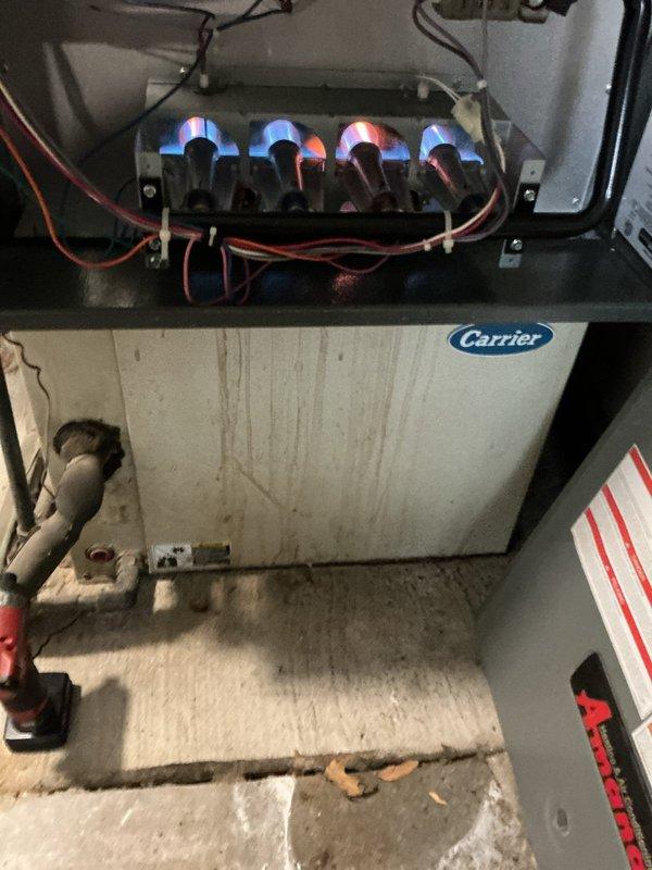 Performed comprehensive tune-up on 12-year-old Carrier gas furnace, including burner inspection with all four burners operating with proper flame pattern. Conducted combustion analysis using Testo 310 II analyzer, confirming excellent efficiency rating of 95.6% with safe CO levels (16 ppm) and appropriate air/fuel mixture parameters. System is functioning within manufacturer specifications with no immediate concerns identified.