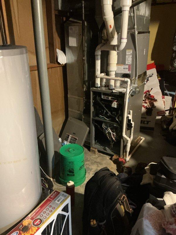 Performed routine furnace maintenance and conducted combustion analysis using Testo analyzer, which confirmed proper operation with no CO detected (0 ppm) and normal oxygen levels (20.9%). Inspected internal components with front panel removed, verified proper venting through PVC pipes, and checked drainage system functionality.