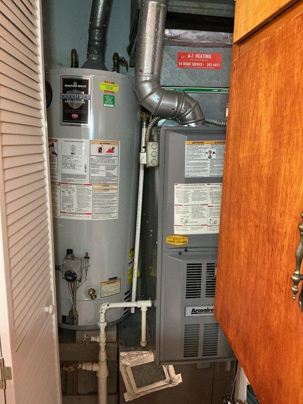 Responded to a no hot water service call. Inspected residential tanked water heater located in utility closet alongside furnace system. Diagnosed issue and restored hot water functionality to the property.