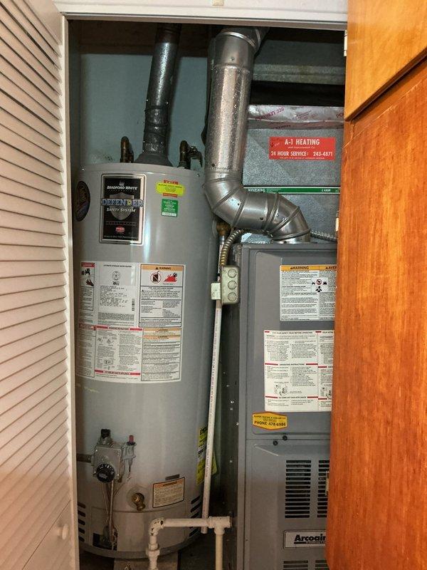 Responded to a no hot water service call. Inspected residential tanked water heater located in utility closet alongside furnace system. Diagnosed issue and restored hot water functionality to the property.
