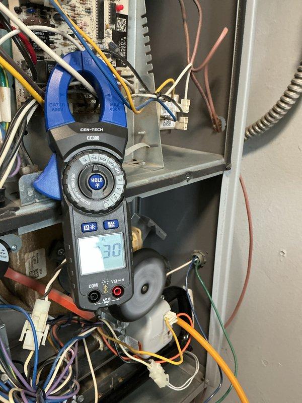 Performed routine furnace maintenance service. Conducted electrical testing with clamp meter on control components, confirming amperage reading of approximately 30. Inspected filter housing area (16x20x1) and ductwork connections for proper installation and condition.