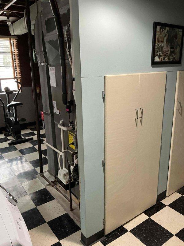 Performed comprehensive maintenance tune-up on residential furnace system located in utility area. Inspected all components including PVC ventilation/drainage pipes, electrical connections, and control elements. System is functioning properly with no issues identified during the preventive maintenance service.