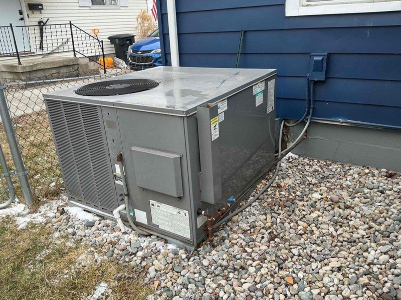 Diagnosed 15-year-old heat pump system with no heat complaint; inspection revealed severe corrosion on the indoor coil and heat exchanger components. System was short-cycling due to failed defrost board and deteriorated reversing valve, preventing proper heat mode operation. Replaced defrost control board, cleaned accessible components, and restored heating functionality with recommendation for full system replacement due to extensive age-related deterioration and inefficiency.