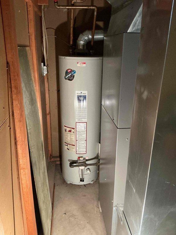 Responded to service call for 17-year-old gas furnace making noise. Performed diagnostic testing with clamp meter on electrical components, examining motor and internal wiring connections. Inspected adjacent water heater installation while on site to ensure proper ventilation and clearance between appliances.