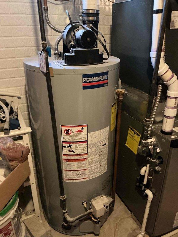 Performed scheduled furnace maintenance in basement mechanical room. Inspected Lennox furnace system with proper PVC venting, confirmed water heater (Powerflex) was operating normally, and verified all connections were secure. No issues found during tune-up service.