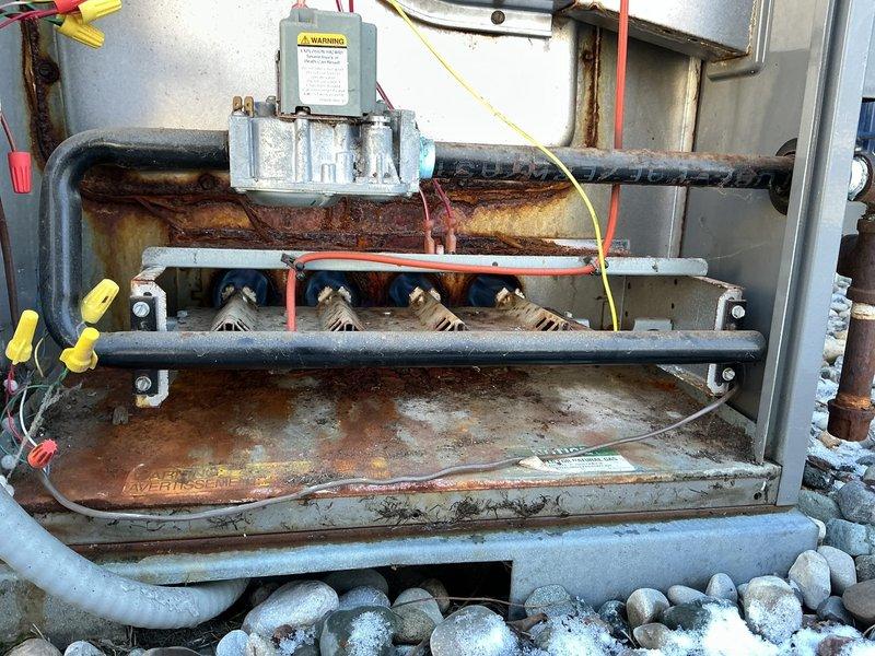 Returned to property to complete scheduled inducer motor replacement in aging furnace system. Successfully installed new inducer motor, resolving operational issues that were evident from significant rust and corrosion observed throughout the heat exchanger and lower components. System now functioning properly with all connections secured and tested.