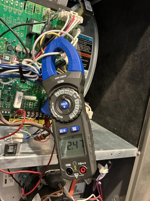 Performed scheduled furnace maintenance on natural gas heating system. Conducted complete diagnostic testing including electrical measurements with clamp meter, showing 24.7 amps on control board. Inspected gas valve assembly and connections, verified proper operation of all components with no issues detected.
