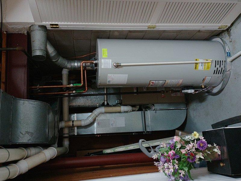 Performed scheduled maintenance inspection on residential furnace system. Identified water leak underneath the unit with visible staining on the floor. Visual inspection of internal components completed with front panel removed, showing proper wiring connections but evidence of water intrusion requiring further attention.