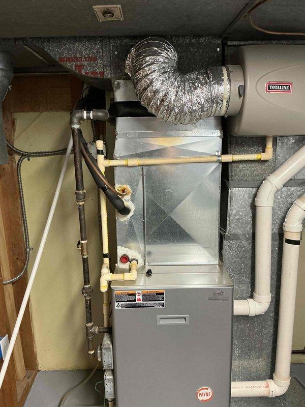 Diagnosed and serviced a 14-year-old Payne furnace that was non-operational. After inspection of the internal components including blower motor, circuit board, and wiring, performed necessary repairs to restore heating function. System is now operating within normal parameters with proper ventilation through the PVC intake and exhaust vents.