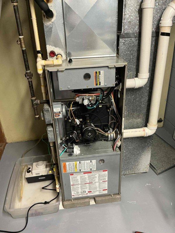 Diagnosed and serviced a 14-year-old Payne furnace that was non-operational. After inspection of the internal components including blower motor, circuit board, and wiring, performed necessary repairs to restore heating function. System is now operating within normal parameters with proper ventilation through the PVC intake and exhaust vents.