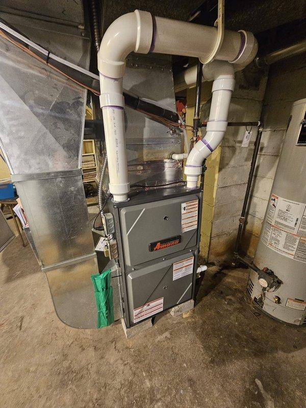 Completed warranty replacement of Amana furnace in basement mechanical room, ensuring proper installation with level placement of the unit. Connected PVC exhaust/intake system to existing ductwork and verified electrical connections were properly secured and functioning.