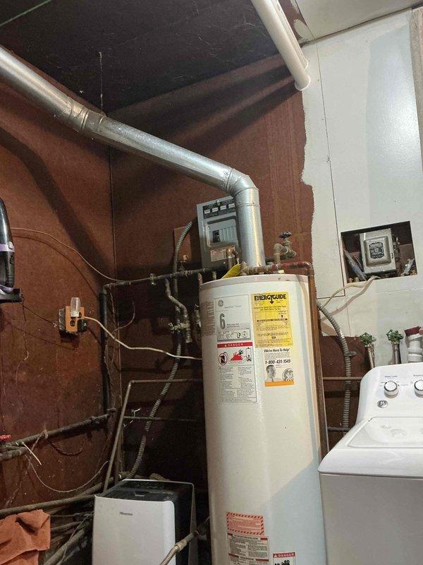 Performed scheduled heating maintenance service at 8am. Inspected water heater system with visible plumbing connections and ductwork. Conducted combustion analysis using Testo 310 II analyzer, which showed excellent efficiency (97.1%) with proper O₂ levels (7.4%), minimal CO production (11 ppm), and optimal CO₂ readings (8.93%) for the propane system.