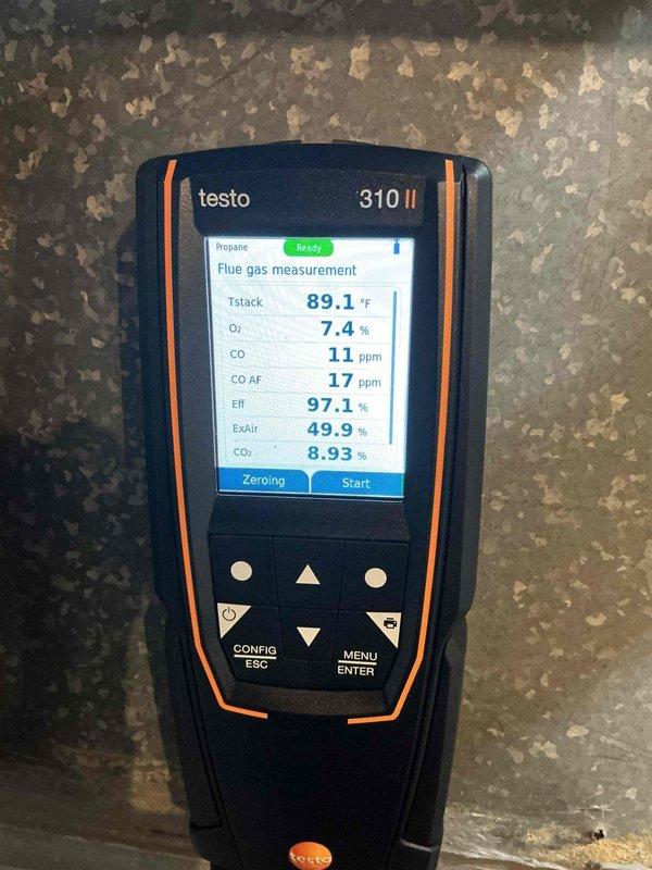 Performed scheduled heating maintenance service at 8am. Inspected water heater system with visible plumbing connections and ductwork. Conducted combustion analysis using Testo 310 II analyzer, which showed excellent efficiency (97.1%) with proper O₂ levels (7.4%), minimal CO production (11 ppm), and optimal CO₂ readings (8.93%) for the propane system.