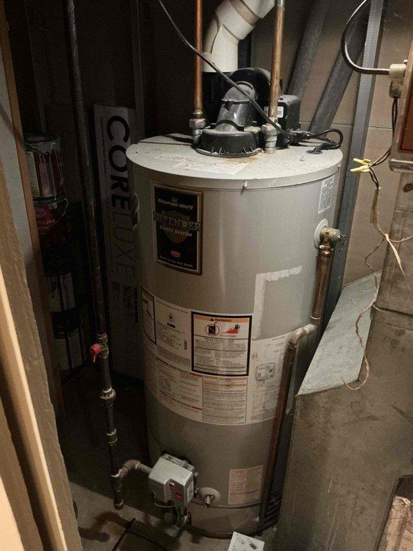 Performed scheduled maintenance tune-up on a 5-year-old Olsen furnace system. Inspected and documented condition of equipment, including furnace and adjacent water heater installation with proper venting. All components functioning within normal parameters; no immediate service issues identified.