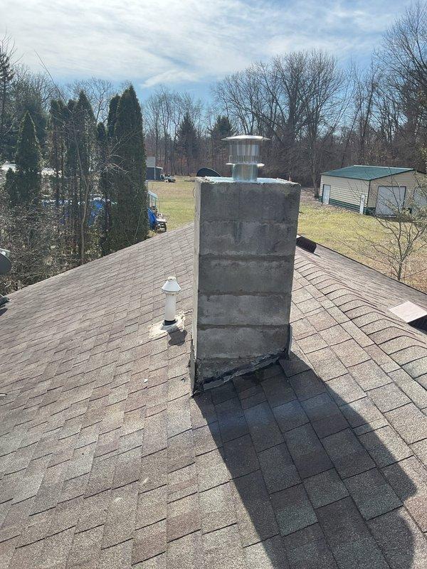 Completed chimney liner replacement and installed new flue pipe connecting to furnace and water heater. Repaired gas line connections to both appliances, ensuring proper venting and safe operation of the heating system.