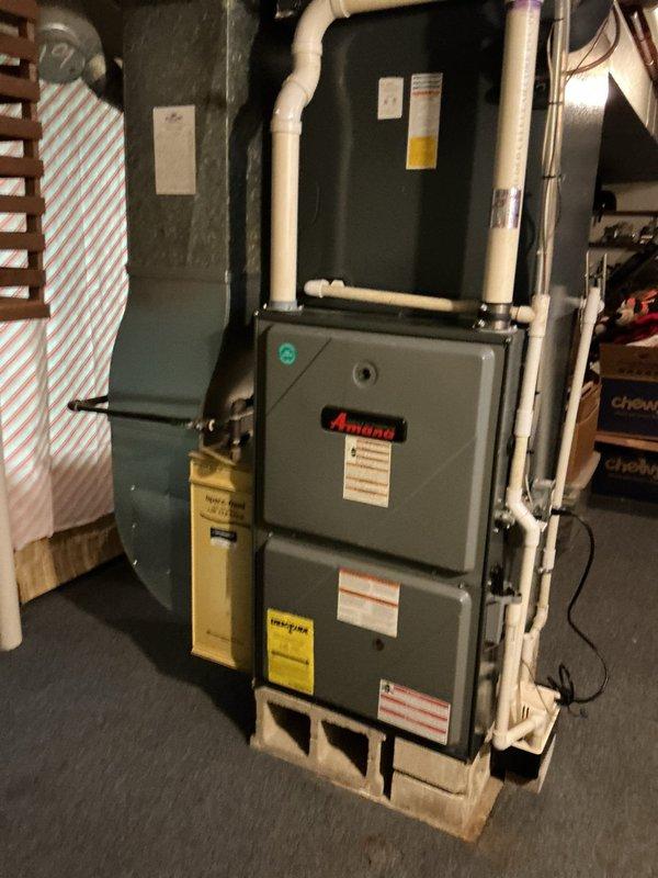 Performed scheduled maintenance on Amana furnace system. Inspected flame sensor, gas valve connections, and electrical components for proper operation. Noted MVP service agreement has expired; customer needs to update payment information before additional service can be scheduled.