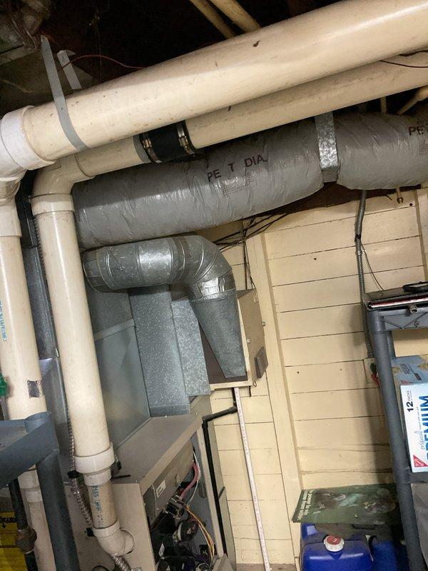 Conducted a comprehensive assessment of the existing HVAC system in the residential mechanical room, documenting the current furnace installation with exposed internal components and associated ductwork. Took detailed measurements and photographs of the complete setup, including the insulated duct piping, PVC ventilation lines, and connection points to facilitate accurate replacement planning. Finalized quote for system replacement and collected initial down payment from customer.