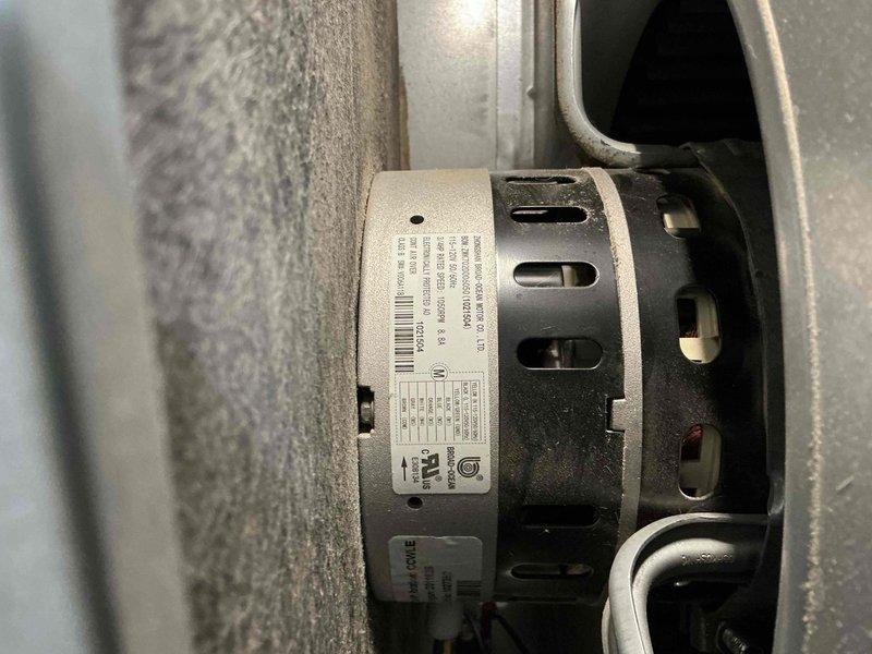 Performed scheduled heating maintenance service with focus on inspection of electric motor components and housing unit. Checked motor specifications, wiring connections and mounting integrity within the ventilation system. Examined wall-mounted heating unit with louvered panels for proper airflow and verified operational status.