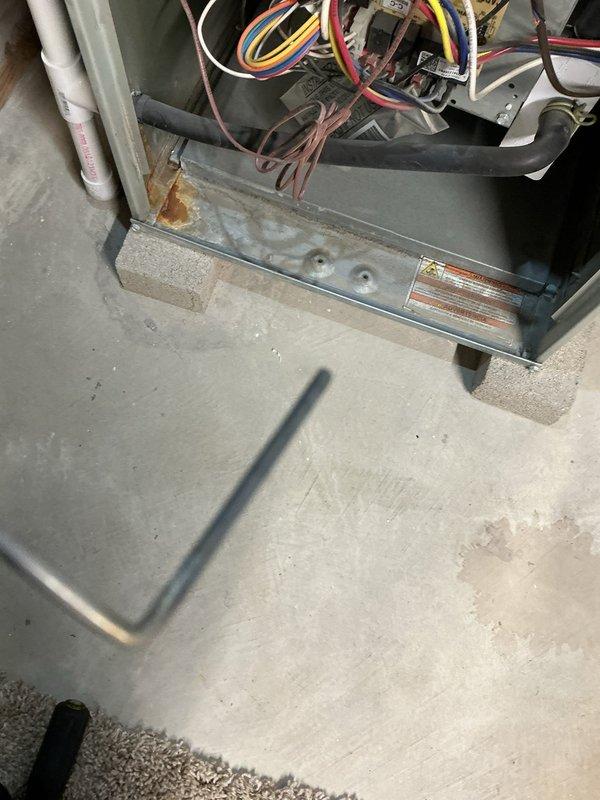 Performed routine heating maintenance on a 10+ year old furnace. Conducted combustion analysis with Testo 310 II gas analyzer showing 89.6% efficiency with acceptable CO levels (7 ppm). Inspected electrical connections and wiring at the control board, noting some corrosion on the unit base where it contacts the concrete floor.