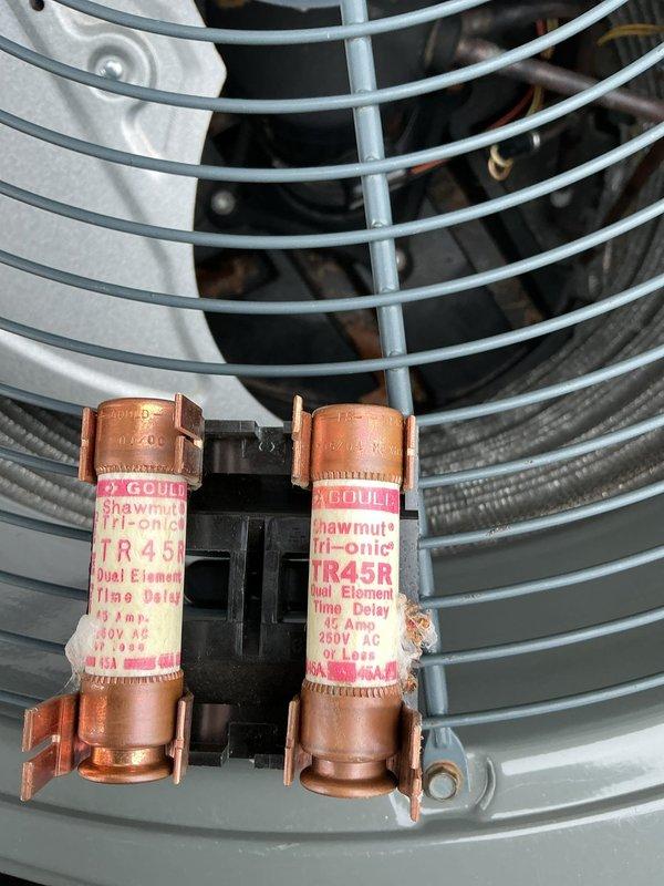 Performed routine A/C maintenance inspection on system. Examined dual element time delay fuses (45A 250V Gould Shawmut Tri-onic TR 45R) and observed some oxidation on copper components. System operating normally after service.