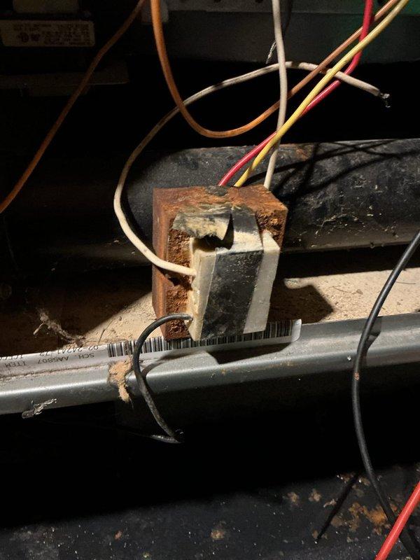 Performed diagnostic service on 10+ year old gas furnace, discovering extensive corrosion and water damage to internal components. Inspection revealed significant rust formation on metal surfaces, moisture accumulation, and potential electrical hazards with exposed/deteriorated wiring connections at the control board. Recommended full system evaluation by sales department for replacement options due to advanced age and safety concerns.