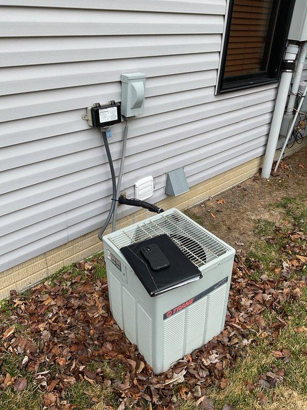 Conducted comprehensive assessment of existing Trane outdoor AC unit showing signs of wear, positioned adjacent to house foundation with proper electrical connections. Inspected electrical panel to verify circuit capacity for potential system replacement, noting dedicated A/C breaker and overall electrical infrastructure. Provided estimate for full AC replacement with option to include furnace replacement based on evaluation findings.