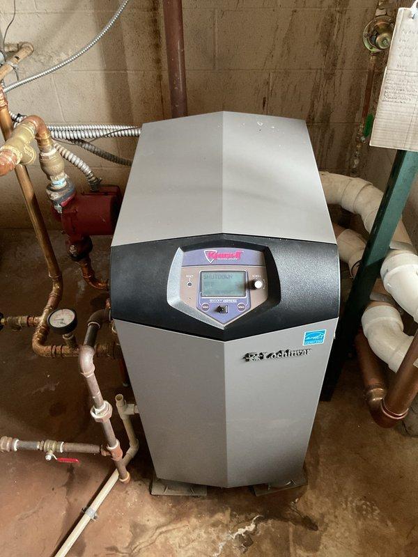 Conducted comprehensive assessment of existing boiler system, documenting severe corrosion on primary valve assembly and deterioration of associated piping infrastructure. Recommended replacement of corroded components and installation of modern high-efficiency unit with digital control interface to prevent potential system failure and improve operational efficiency.