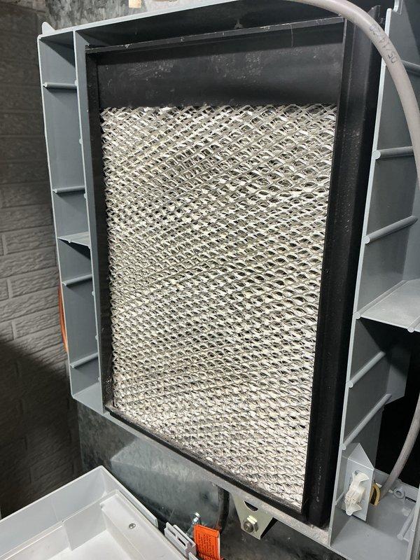 Performed scheduled heating tune-up on system as requested, accessing unit via front circle drive. Inspected humidifier component, noting mineral deposits on evaporative pad and checking water supply line connection. Examined gas valve assembly, control wiring connections, and verified proper operation of all system components.