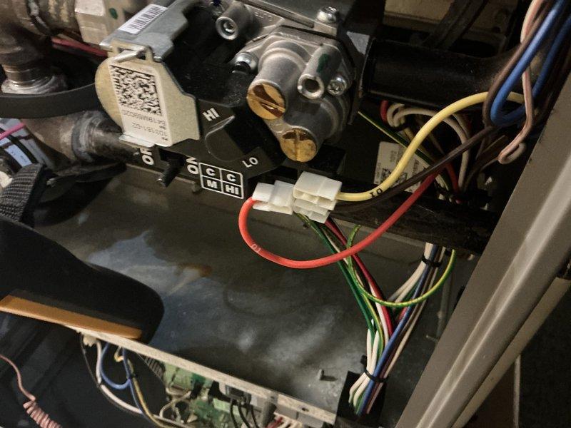 Performed scheduled heating tune-up on system as requested, accessing unit via front circle drive. Inspected humidifier component, noting mineral deposits on evaporative pad and checking water supply line connection. Examined gas valve assembly, control wiring connections, and verified proper operation of all system components.