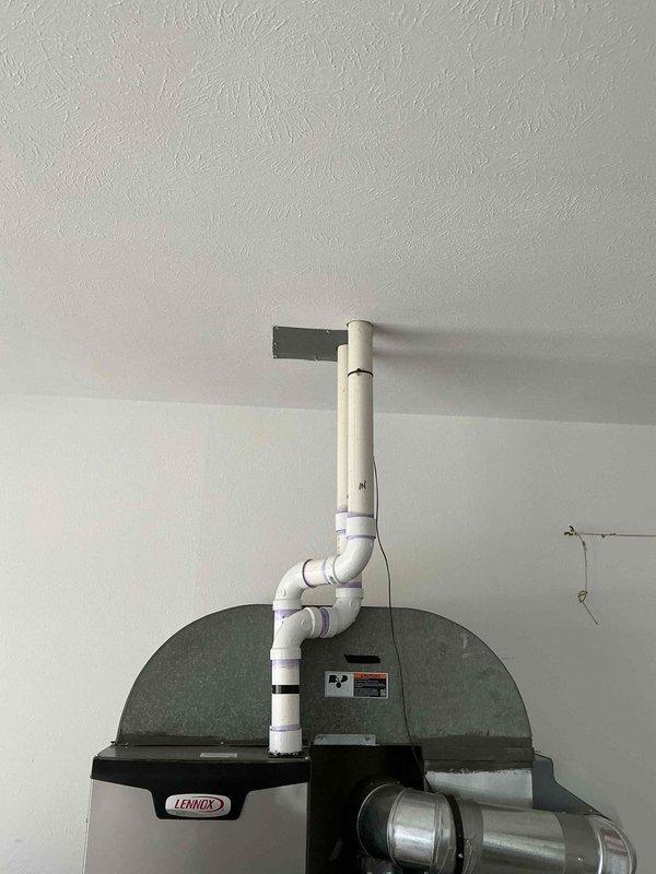 Performed routine maintenance on 2-year-old Lennox furnace system. Inspected PVC ventilation piping and connections, confirming proper sealing at all joints. Verified system operation and airflow through existing ductwork; all components functioning within normal parameters.