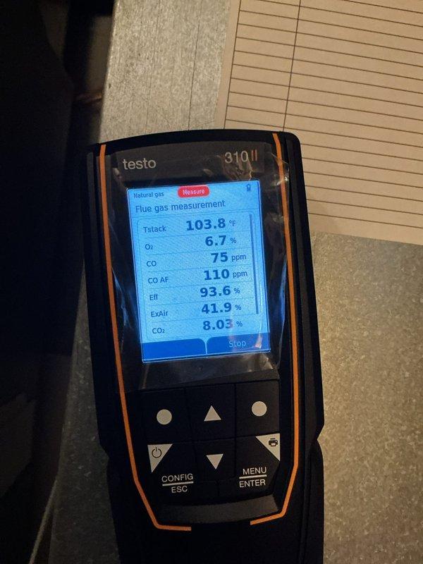 Performed scheduled heating maintenance with call-ahead notification. Conducted combustion analysis using Testo 310 analyzer, confirming proper operation with 93.6% efficiency, CO levels at 75 ppm, and CO₂ at 8.03%. Visual inspection of burner assembly showed normal blue flame pattern with minor corrosion noted around burner ports.