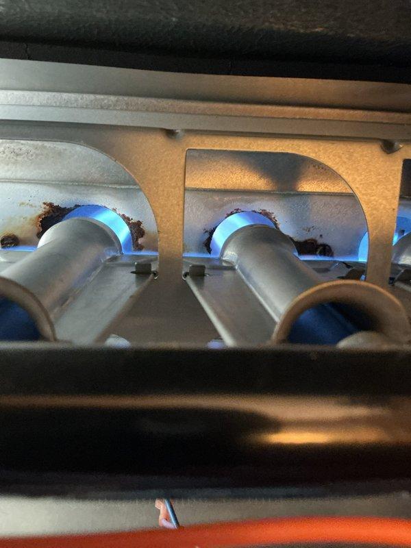 Performed scheduled heating maintenance with call-ahead notification. Conducted combustion analysis using Testo 310 analyzer, confirming proper operation with 93.6% efficiency, CO levels at 75 ppm, and CO₂ at 8.03%. Visual inspection of burner assembly showed normal blue flame pattern with minor corrosion noted around burner ports.