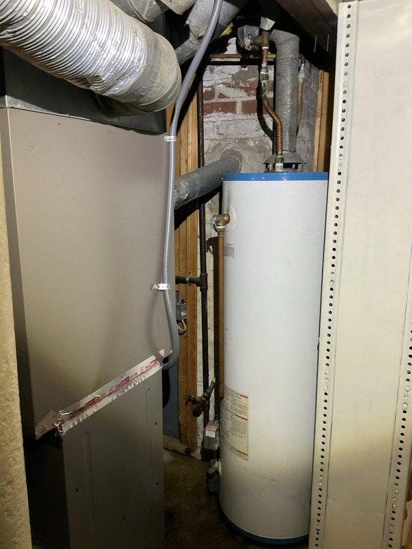 Responded to service call for leaking valve on hot water tank. Upon inspection, identified corrosion on copper flex gas line with visible green patina and deterioration. Replaced faulty valve on hot water heater to eliminate drip leak and restore proper function.