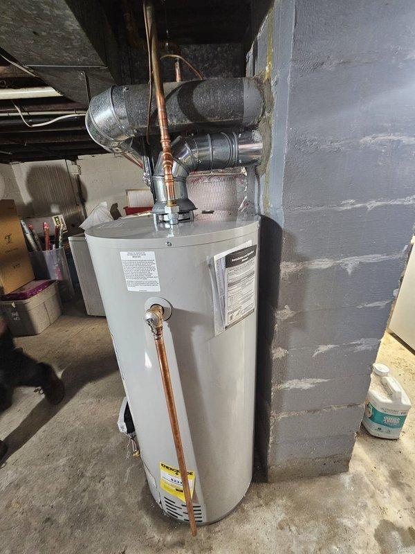 Successfully installed a 40-gallon Bradford White gas water heater in the basement utility area. Connected new copper piping to the unit and properly installed metal ventilation ductwork with appropriate insulation. All connections were tested and confirmed operational before completing the job.