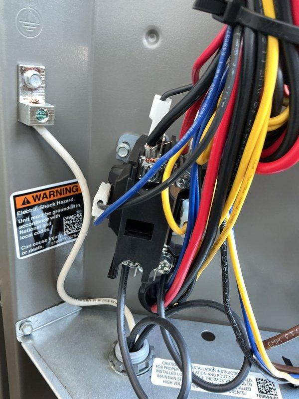 Performed AC start-up service on residential split system. Verified proper electrical connections in control panel with appropriate wire routing and secure terminations. Confirmed outdoor condensing unit was properly installed on concrete pad with all refrigerant lines and electrical conduit correctly connected to structure.