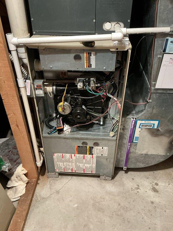 Performed scheduled maintenance on residential heating system. Inspected and documented condition of air filter showing significant dust accumulation requiring replacement. Conducted full system inspection with access panel removed to examine blower assembly, motor, circuit board, and drainage components, all found to be in normal operating condition.