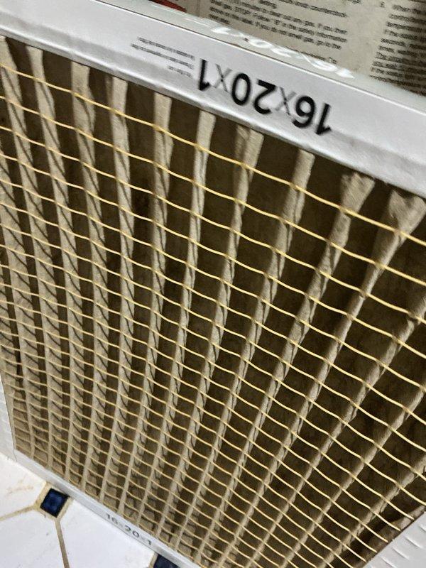 Performed routine maintenance on 12-year-old gas furnace. Inspected burners for proper ignition and flame pattern; observed normal blue flames with no concerning color variations. Checked and replaced standard 16x20x1 air filter, noting some corrosion on connection points but all electrical components functioning properly.