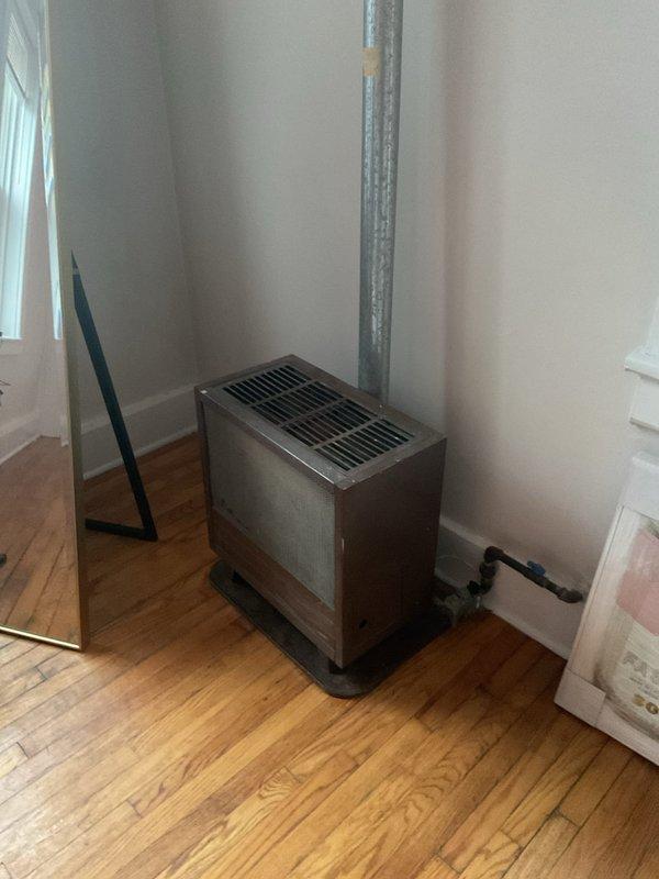 Conducted mini split assessment for replacement of outdated metal heating unit with floor-mounted installation and existing exhaust ventilation. Inspected current PVC ventilation system, noting wear on elbow joints and connection points that would require modification for new system compatibility. Recommended complete replacement of heating system with modern mini split solution to improve efficiency and eliminate ventilation issues.