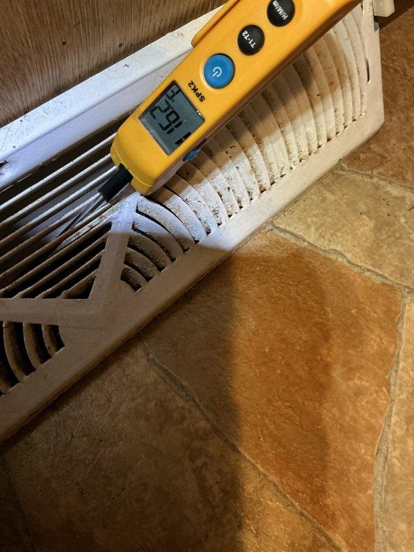 Performed comprehensive furnace tune-up on 7-year-old system. Inspected interior components including electrical connections, PVC venting, and pump assembly. Measured register temperature (69°F) using digital testing equipment to verify proper system operation.