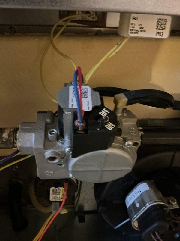 Performed scheduled heating maintenance on HVAC system. Inspected motorized valve assembly with ON/OFF actuator and verified proper electrical connections to control wiring. Confirmed unit leveling using torpedo level on equipment housing to ensure optimal operation of system components.