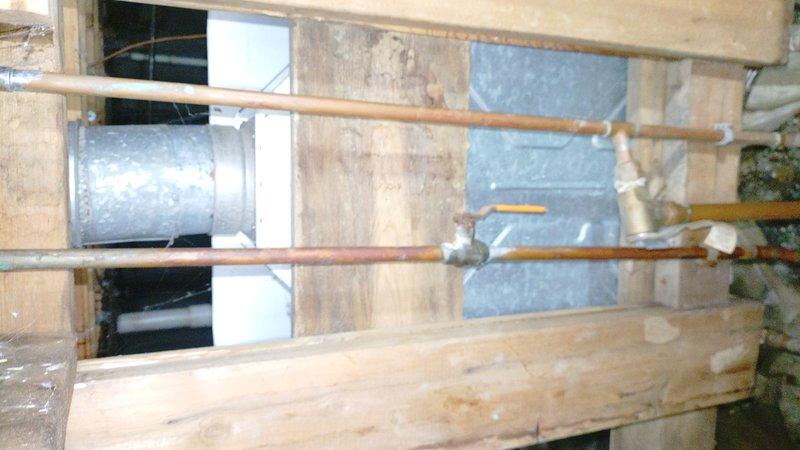 Responded to service call for tankless water heater producing only lukewarm water. Accessed unit in 4-foot crawl space to diagnose issue. Inspected copper piping connections and heating elements, performed necessary maintenance to restore proper hot water temperature functionality.