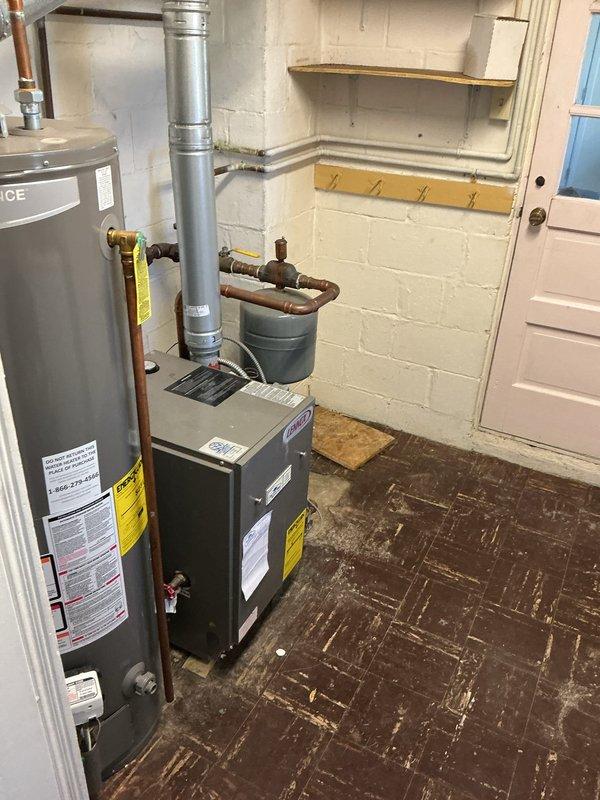 Performed routine service call on 10+ year old boiler system. Confirmed proper operation of the hydronic heating components and inspected pressure gauge which showed signs of condensation. Visual inspection of venting, water heater, and associated piping revealed normal wear consistent with system age.