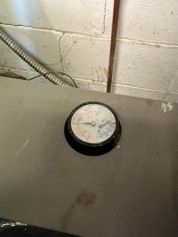 Performed routine service call on 10+ year old boiler system. Confirmed proper operation of the hydronic heating components and inspected pressure gauge which showed signs of condensation. Visual inspection of venting, water heater, and associated piping revealed normal wear consistent with system age.