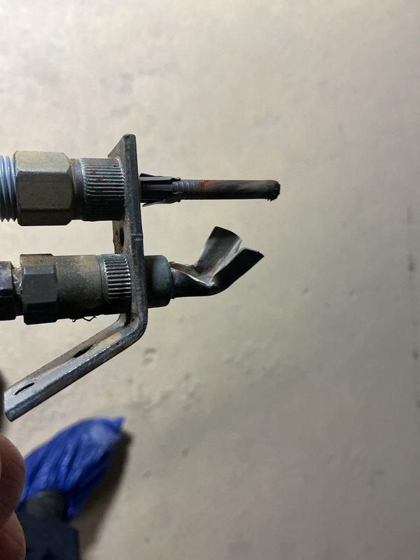 Performed service on boiler system due to intermittent pilot light failure. Inspected pressure gauge and plumbing components showing signs of oxidation. Replaced thermocouple assembly which had deteriorated, restoring proper pilot light operation and system functionality.
