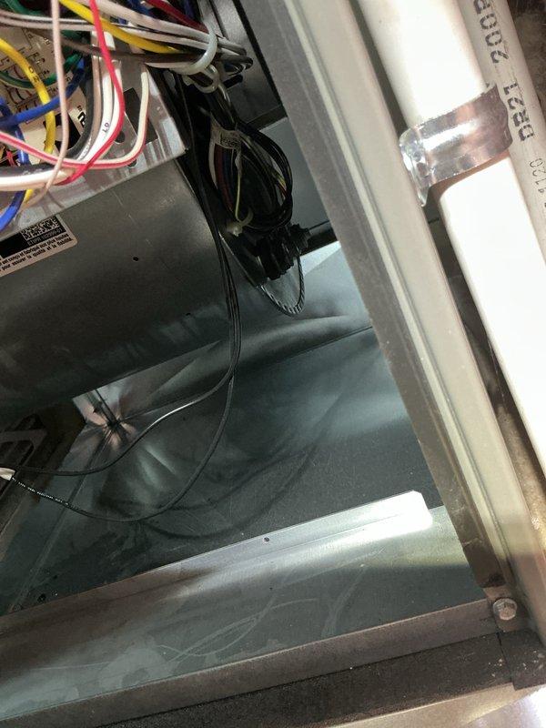 Performed routine furnace maintenance service at 8:00 AM for non-MVP customer. Inspected electrical wiring connections and control board for proper operation. Examined condensate drainage system with PVC piping and insulation integrity inside the unit.