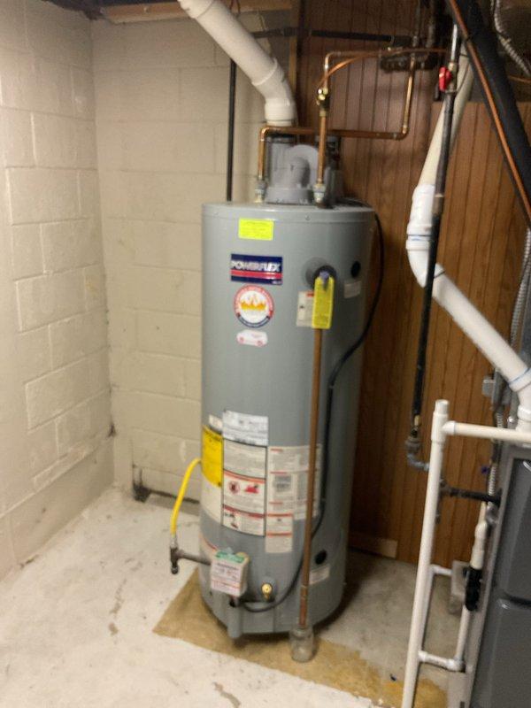 Completed estimate for replacement of existing water heater with a new 50-gallon PowerFlex power vent unit. Assessed current installation configuration in basement utility area, noting copper supply lines, PVC venting, and gas connection requirements. Documented existing setup with photos to ensure proper sizing and compatibility for the proposed replacement.