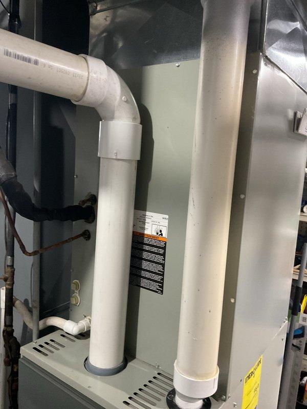 Conducted comprehensive assessment of existing Trane furnace system and provided detailed replacement estimate. Evaluated current installation including ventilation configuration with dual PVC exhaust pipes, condensate drainage system, and surrounding utility space conditions. Documented unit specifications and connections via photographic evidence to ensure accurate replacement proposal.